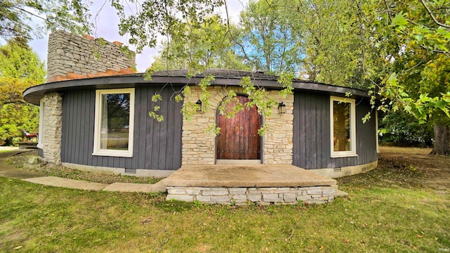 view of outdoor structure with a lawn