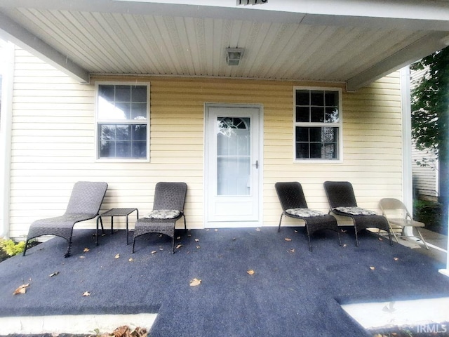 doorway to property with a patio area