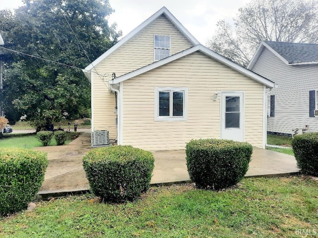 back of house with central AC and a patio area