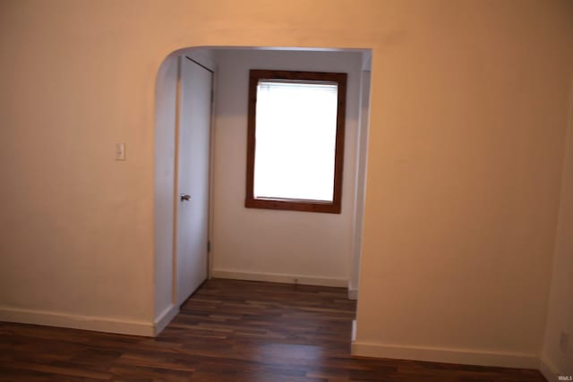 hall featuring dark wood-type flooring