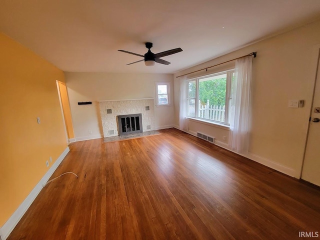 unfurnished living room with wood-type flooring and ceiling fan