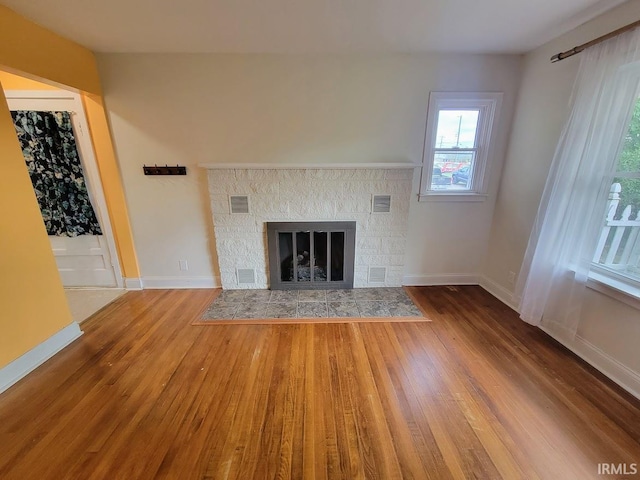 unfurnished living room with wood-type flooring