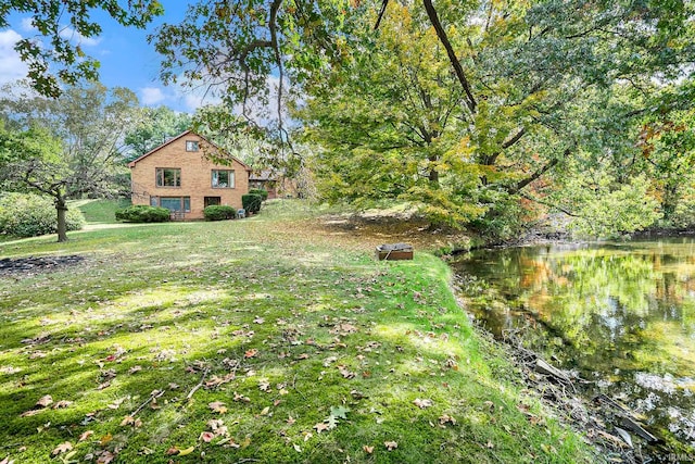 view of yard with a water view