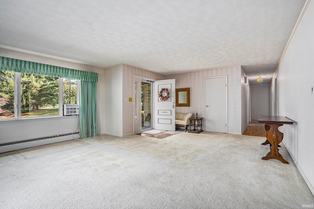 unfurnished living room featuring carpet, a textured ceiling, and a baseboard radiator