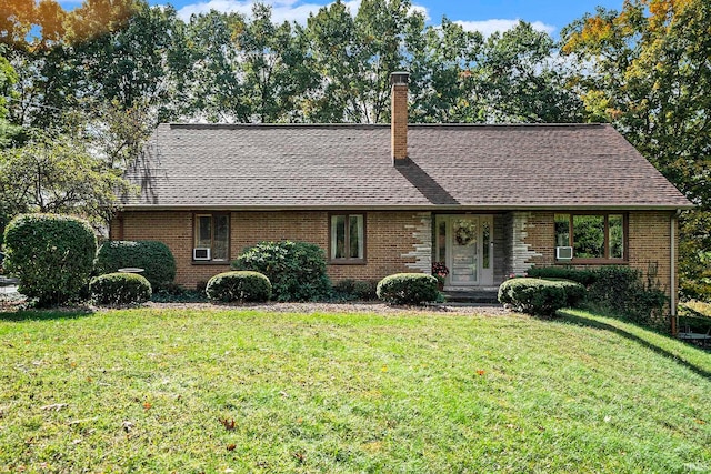 ranch-style home featuring a front yard