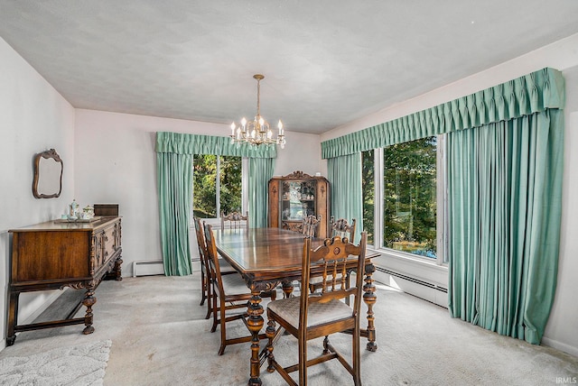 dining area with light carpet, a healthy amount of sunlight, and a baseboard heating unit