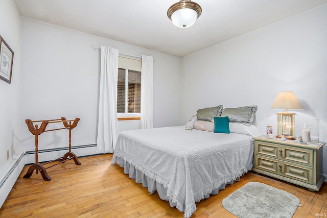 bedroom with hardwood / wood-style flooring