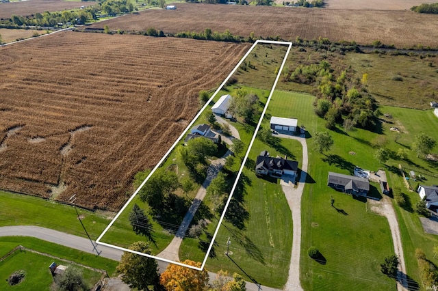 birds eye view of property featuring a rural view