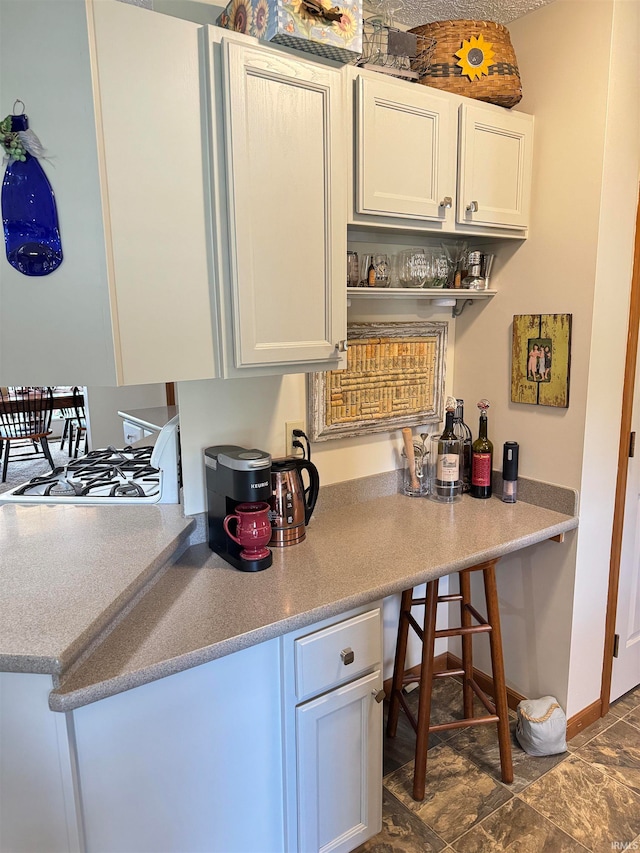 kitchen featuring white cabinetry