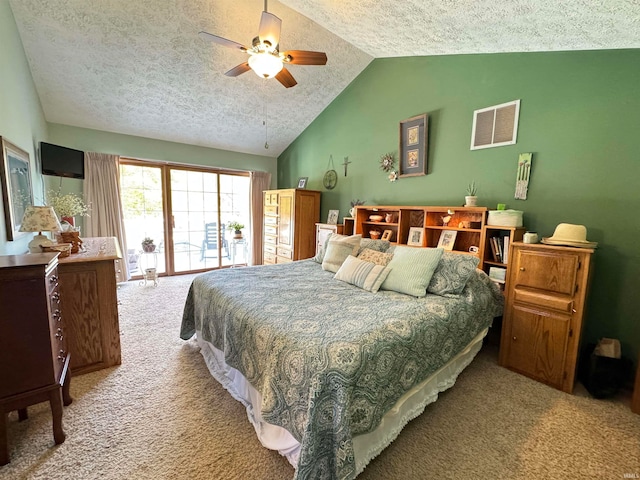 carpeted bedroom featuring ceiling fan, vaulted ceiling, and a textured ceiling