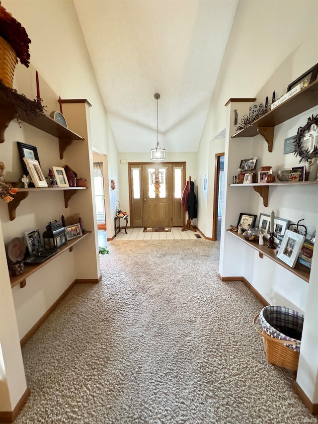 interior space featuring vaulted ceiling and light carpet