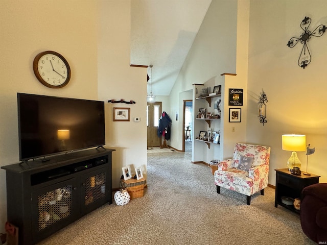 carpeted living room featuring high vaulted ceiling