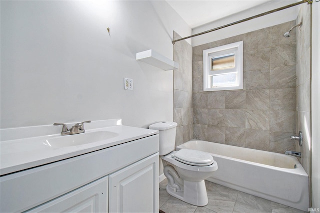 full bathroom with vanity, toilet, and tiled shower / bath