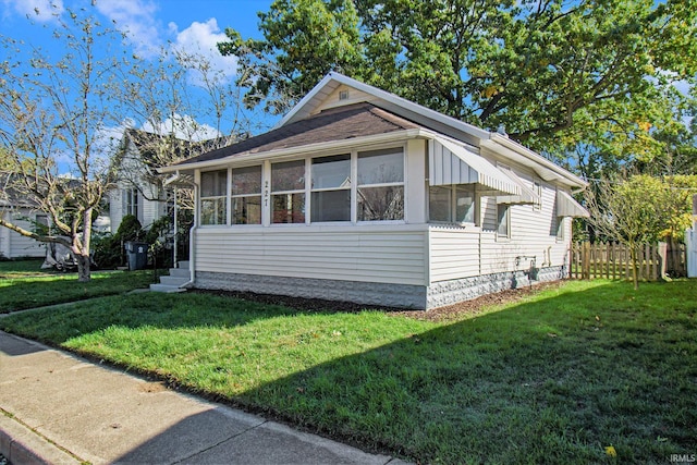 view of home's exterior featuring a yard