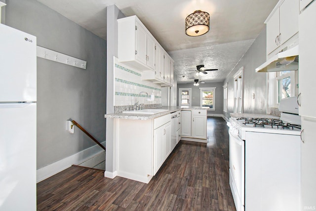 kitchen featuring white cabinets, white appliances, sink, dark hardwood / wood-style flooring, and backsplash