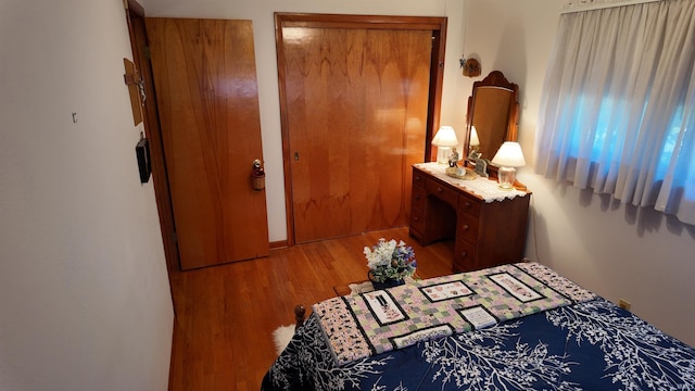 bedroom with hardwood / wood-style flooring