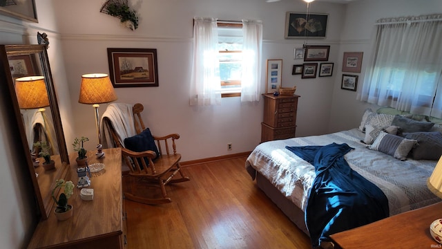 bedroom with light hardwood / wood-style floors