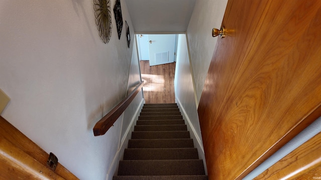 stairs with hardwood / wood-style flooring