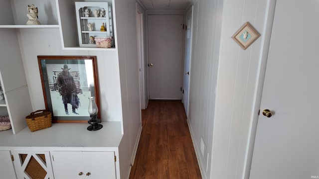 corridor featuring dark hardwood / wood-style flooring