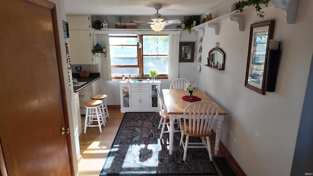 dining room featuring ceiling fan and hardwood / wood-style floors