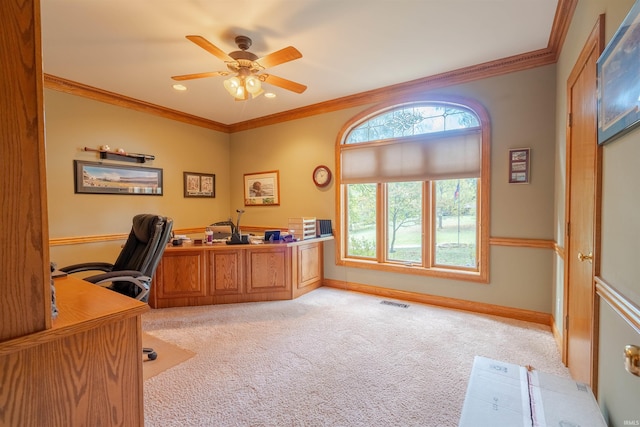 carpeted office with crown molding and ceiling fan