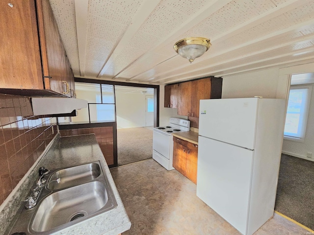 kitchen with white appliances and sink