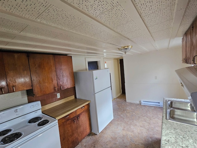 kitchen with white appliances, sink, and baseboard heating