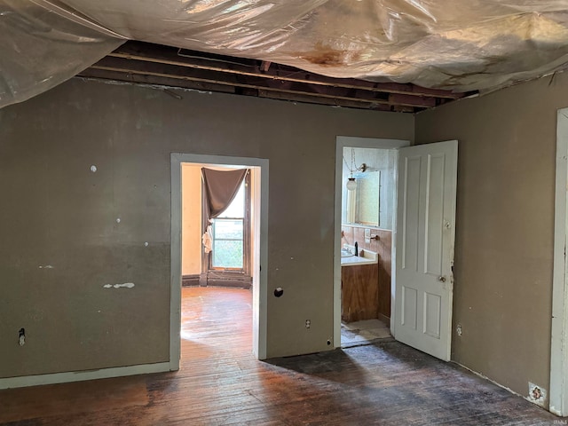 empty room with dark hardwood / wood-style flooring