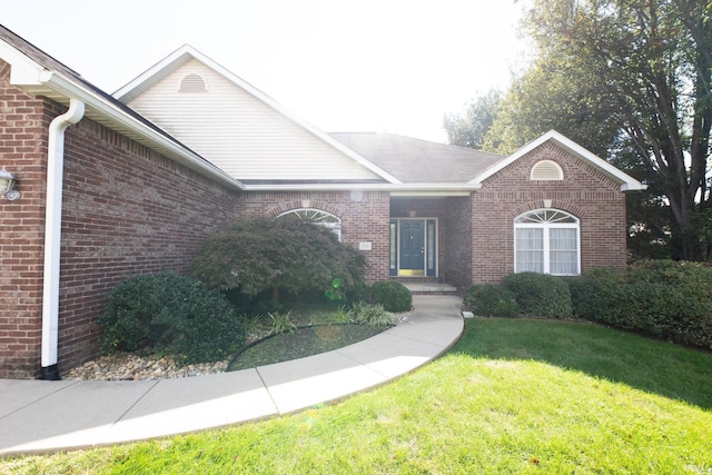 ranch-style house with a front lawn