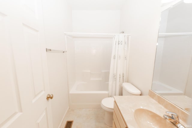 full bathroom with tile patterned flooring, shower / bath combo with shower curtain, vanity, and toilet