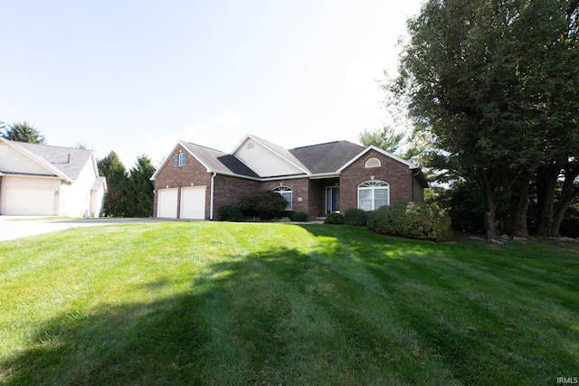 ranch-style home featuring a garage and a front lawn