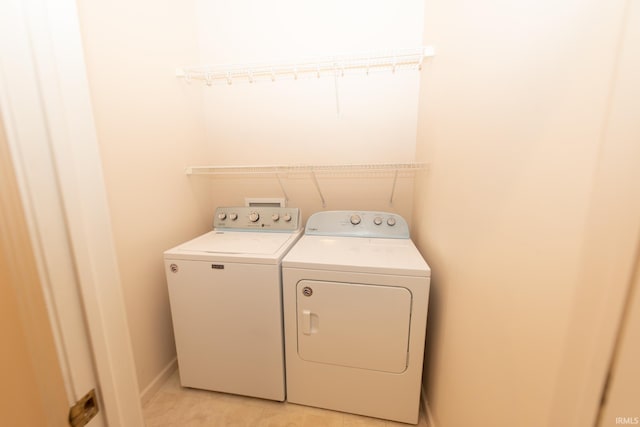 washroom featuring washer and dryer