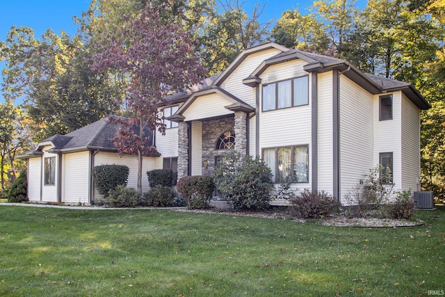 view of front of house featuring a front yard and central air condition unit