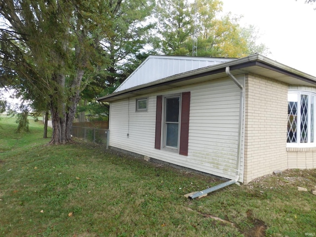 view of property exterior featuring a yard