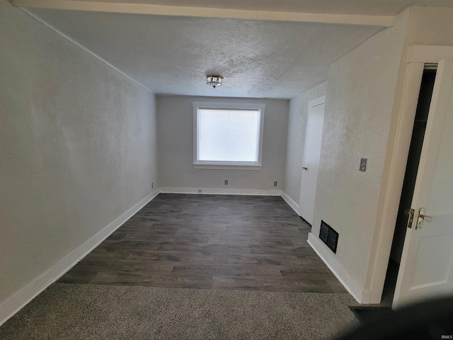 spare room with dark wood-type flooring