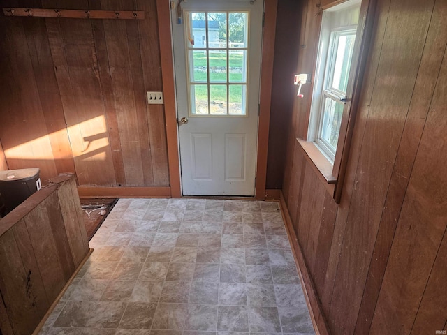 doorway with wood walls