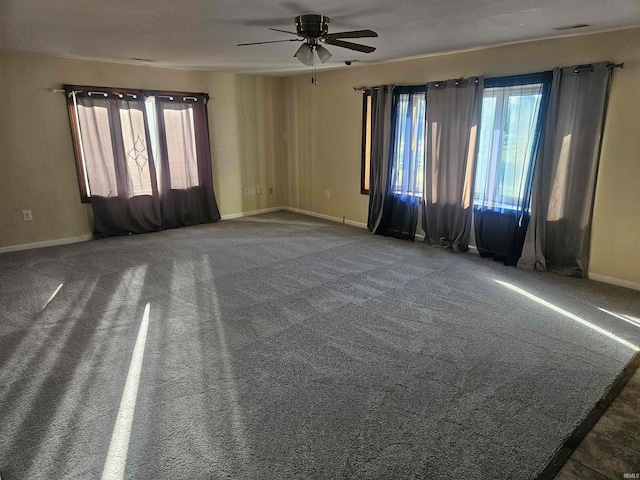 spare room with ceiling fan, a textured ceiling, and carpet flooring