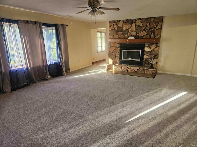 unfurnished living room with ceiling fan, carpet flooring, and a healthy amount of sunlight