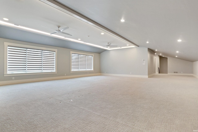 carpeted empty room featuring ceiling fan and lofted ceiling