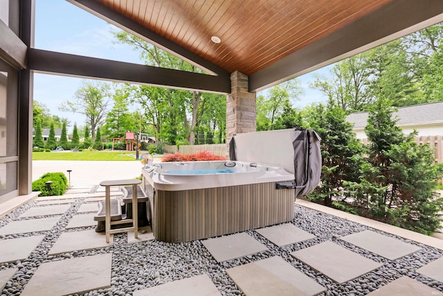 view of patio / terrace with a hot tub