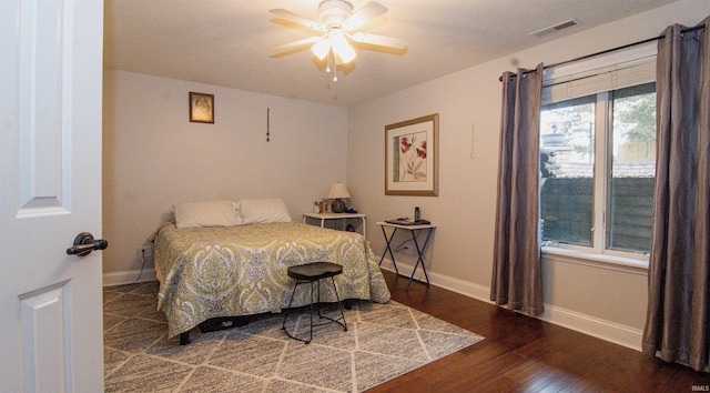 bedroom featuring hardwood / wood-style flooring and ceiling fan