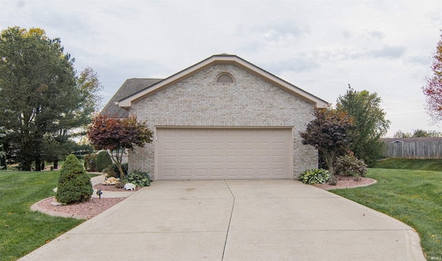 view of front facade featuring a garage and a front lawn