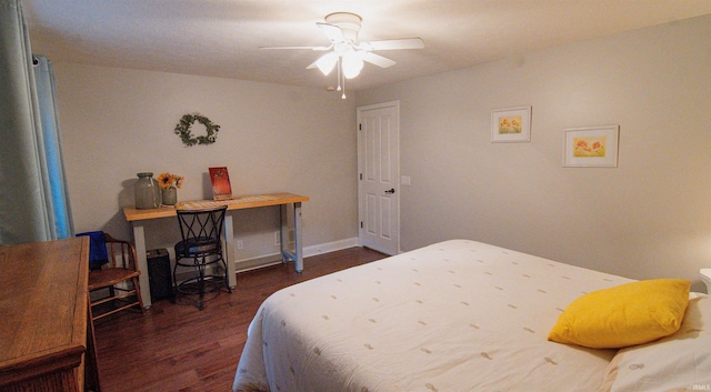 bedroom with dark wood-type flooring and ceiling fan