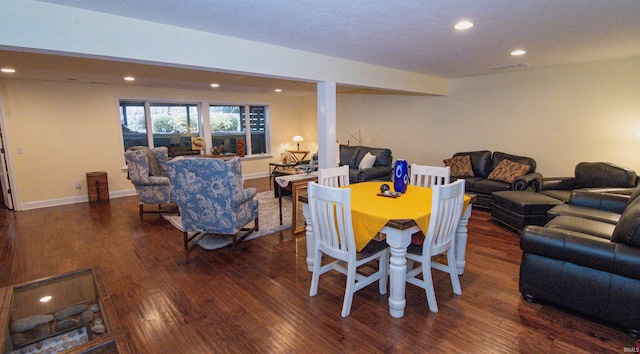 dining space featuring dark hardwood / wood-style flooring