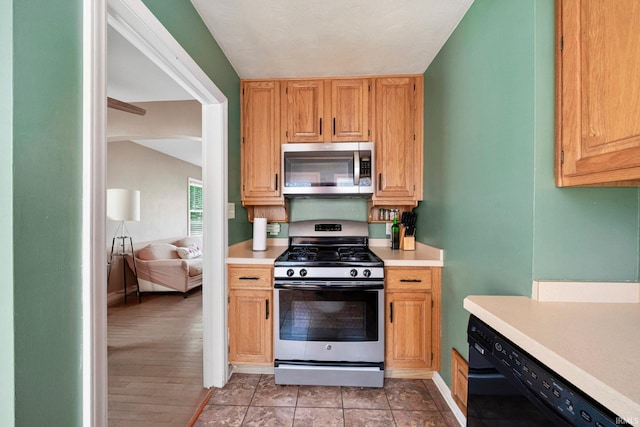 kitchen featuring stainless steel appliances and light hardwood / wood-style flooring