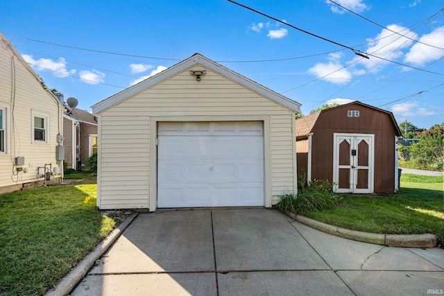 garage featuring a lawn