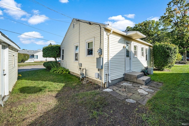 view of home's exterior featuring a yard