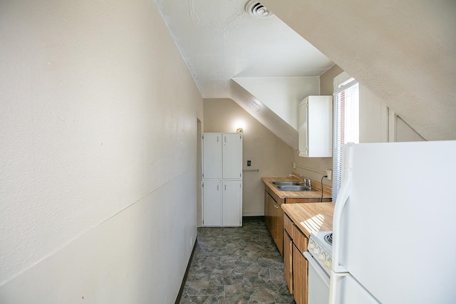 kitchen featuring sink and white appliances