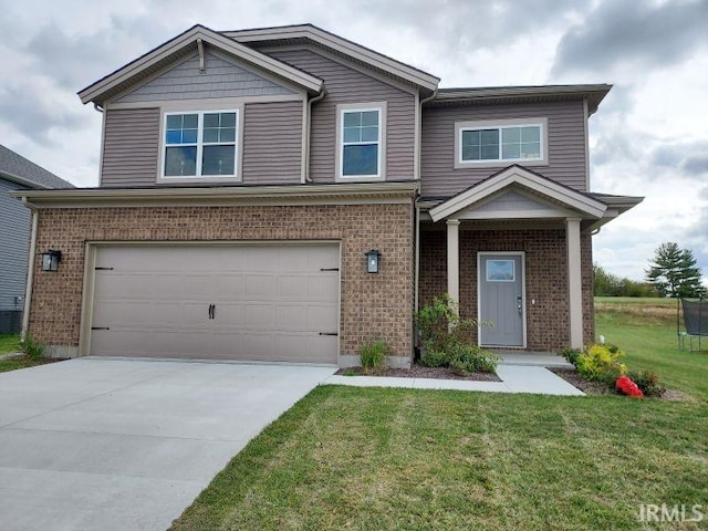 craftsman inspired home with a garage and a front lawn