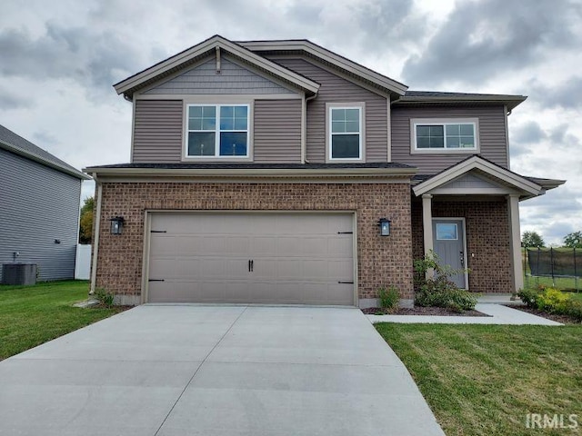 craftsman house featuring a garage, a front yard, and central AC unit